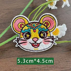 Chinese zodiac rat embroidered stick-on patch — round white muzzle gold floral crown star eyes opera face-paint style