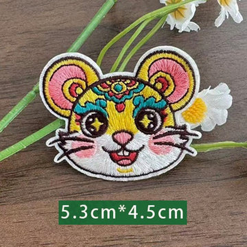 Chinese zodiac rat embroidered stick-on patch — round white muzzle gold floral crown star eyes opera face-paint style