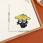 Black cat embroidered stick-on patch beneath a yellow flower-shaped umbrella with a green stem
