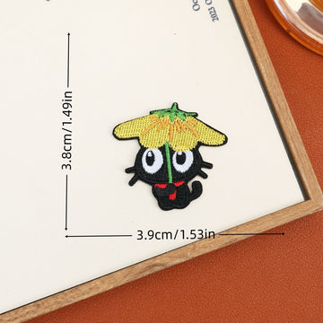 Black cat embroidered stick-on patch beneath a yellow flower-shaped umbrella with a green stem
