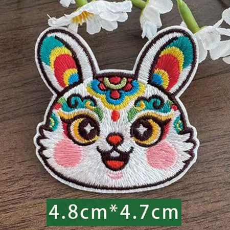 Chinese zodiac rabbit embroidered stick-on patch — soft pink and teal with long embroidered ears opera style star pupils