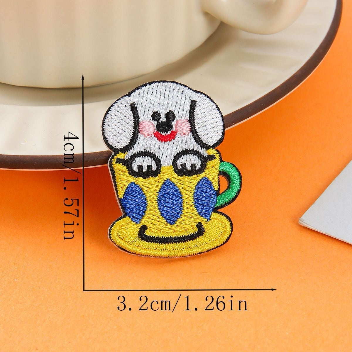 white dog in yellow patterned cup embroidered stick-on patch