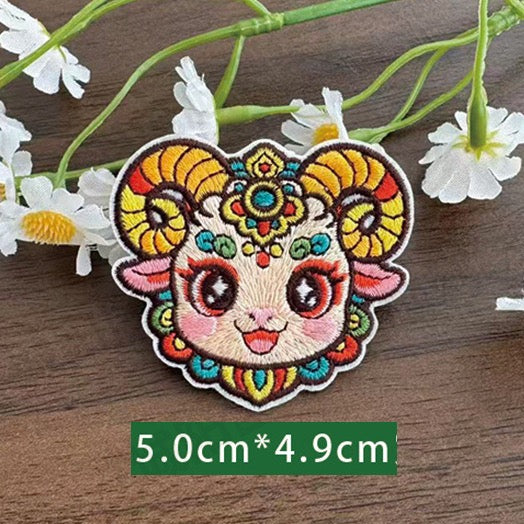 Chinese zodiac goat embroidered stick-on patch — curved horns gentle face delicate forehead detailing opera style
