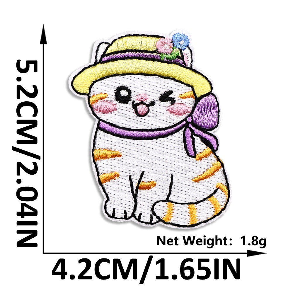 orange tabby in yellow straw hat with purple ribbon embroidered patch