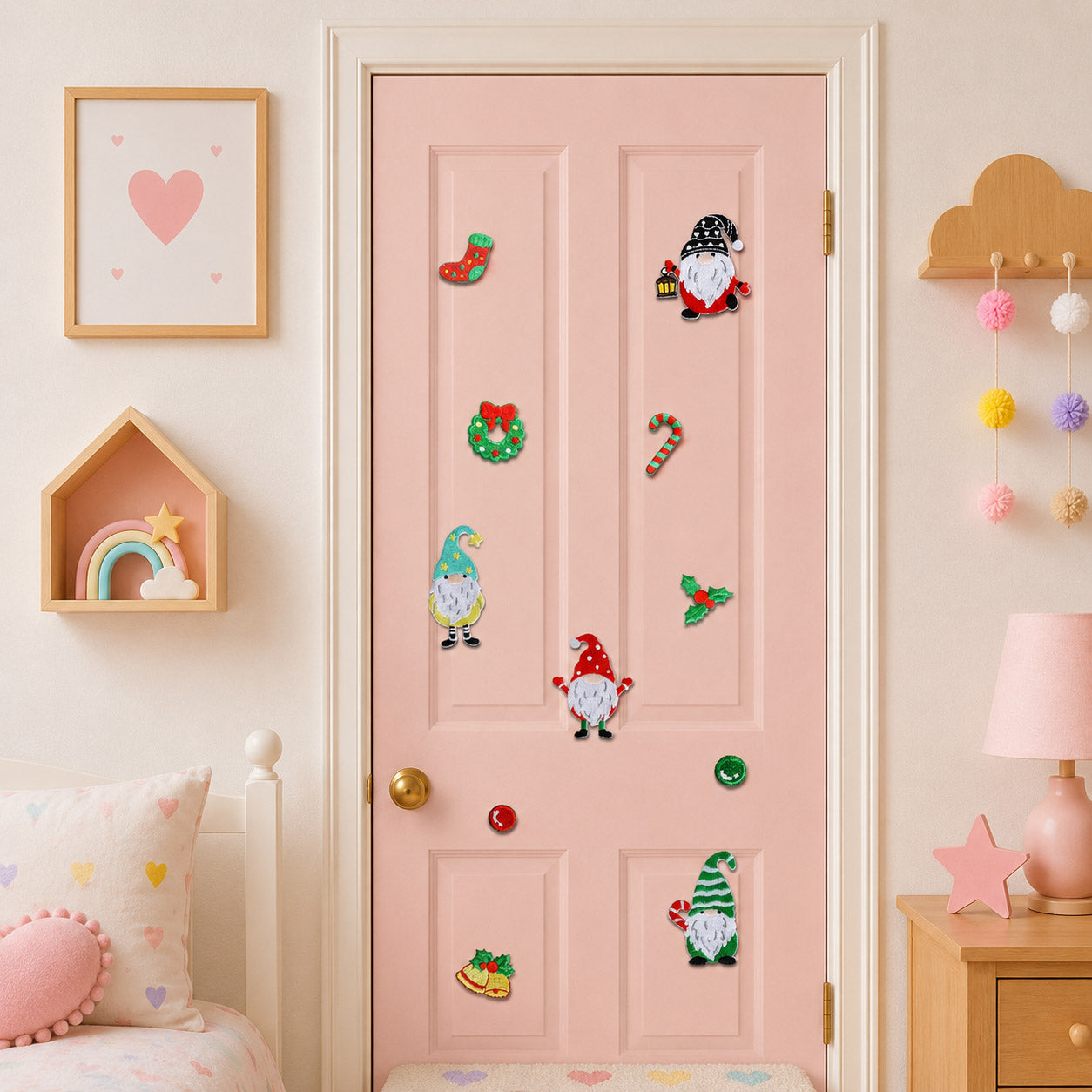 eleven christmas gnome and holiday element embroidered patches with wreath stocking candy cane and bells stuck on a pink bedroom door