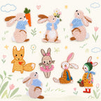 Eight storybook animal embroidered patches featuring seven dressed bunnies and a fox holding a red heart
