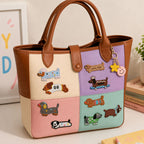 funny dachshund in outfits stick-on patches decorating a brown-trimmed color-block leather handbag