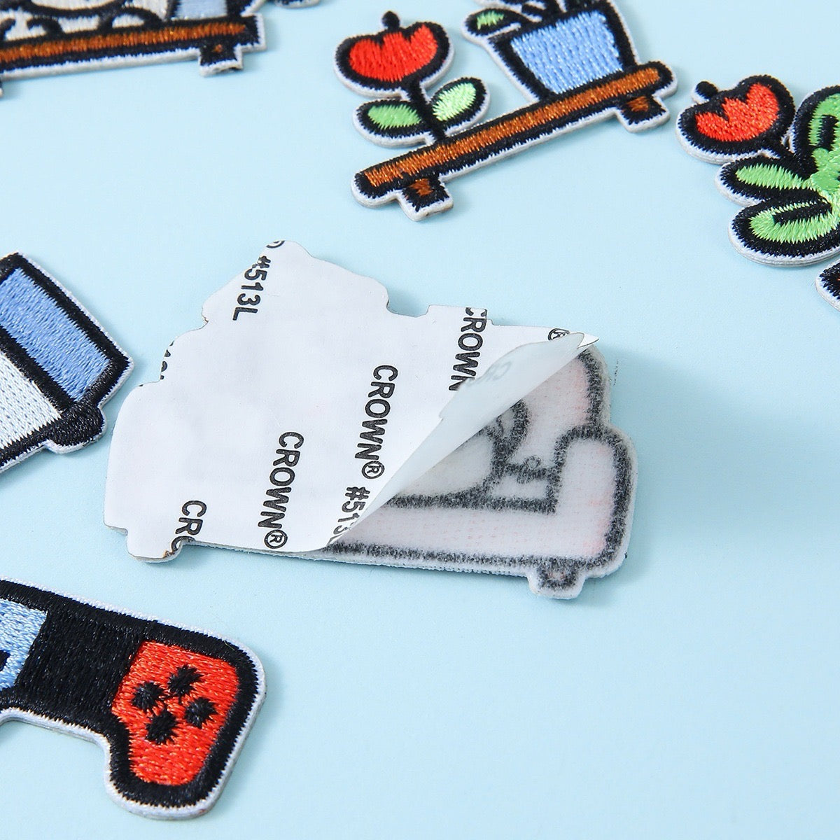cozy dog daily life embroidered stick-on patch showing peel-and-stick adhesive backing