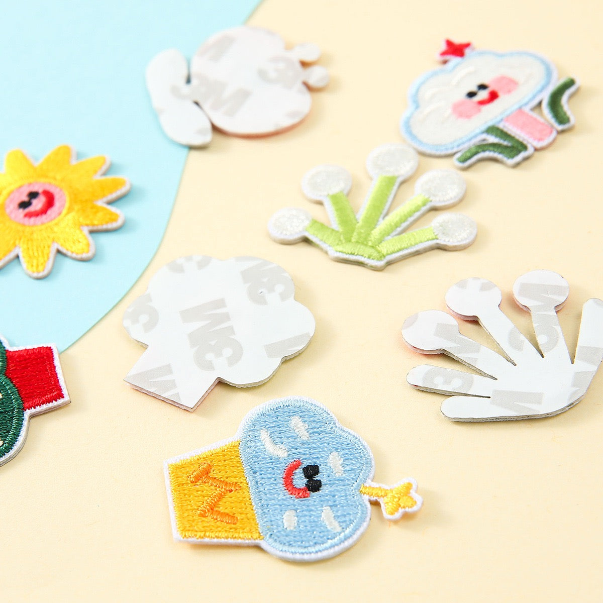 peel-and-stick backing of pastel botanical embroidered patch