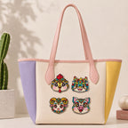 multiple Chinese zodiac animal embroidered stick-on patches on canvas tote bag showing different zodiac signs
