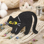 black cat expressions embroidered stick-on patches — ten poses including sitting loafing lying stretching paw licking and arched halloween cat