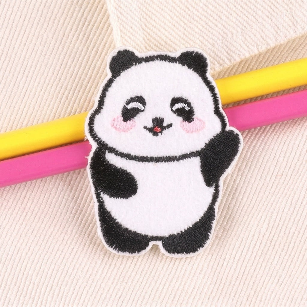 Cute waving panda embroidered stick-on patch with black-and-white stitching and rosy cheeks
