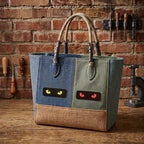 glow-in-the-dark cat eye embroidered stick-on patch on canvas tote bag