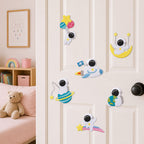 astronaut floating with balloons riding rocket sitting on moon hugging earth and lying on rainbow stick-on patches on a white bedroom door