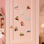nine cute animal kingdom embroidered patches with pig polar bear sloth squirrel panda and rabbit stuck on a pink wardrobe door