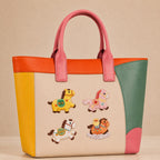 colorful chinese lucky horse with floral saddle and cloud stick-on patches decorating a pink and orange color-block leather handbag