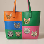 famous cat breed embroidered stick-on patches on a colorful color-block leather tote bag