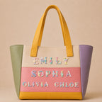 floral alphabet embroidered patches spelling names on a pastel color-block leather tote bag