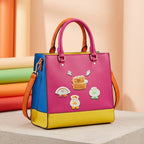 steamer basket shrimp dumpling and tang yuan embroidered patches decorating a hot pink color-block tote