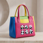 cute kawaii panda stick-on patches decorating a bold pink color-block leather tote