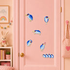 chubby blue gray night heron with red eyes in six poses including birthday hat and four birds in a row stick-on patches on a pink door in a pastel room