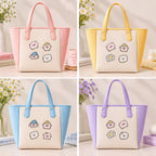 Piglet, star, and cloud embroidered stick-on patches decorating pink, yellow, blue, and lavender tote bags
