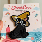 animated hand holding packaged kawaii witchy black cat magic hat embroidered patches showing three styles and detailed embroidery texture