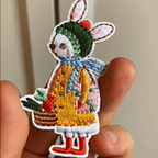Animated display of storybook bunny and fox embroidered stick-on patches