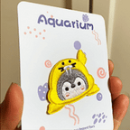 animated hand holding packaged aquarium penguin costume embroidered patches showing three styles and detailed embroidery texture