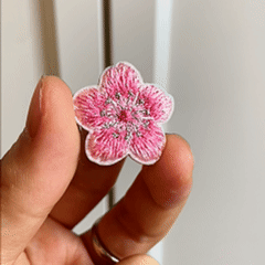  Animated display of colorful cherry blossom embroidered stick-on patches
