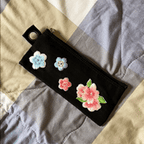 Animated display of pink cherry blossom embroidered stick-on patches