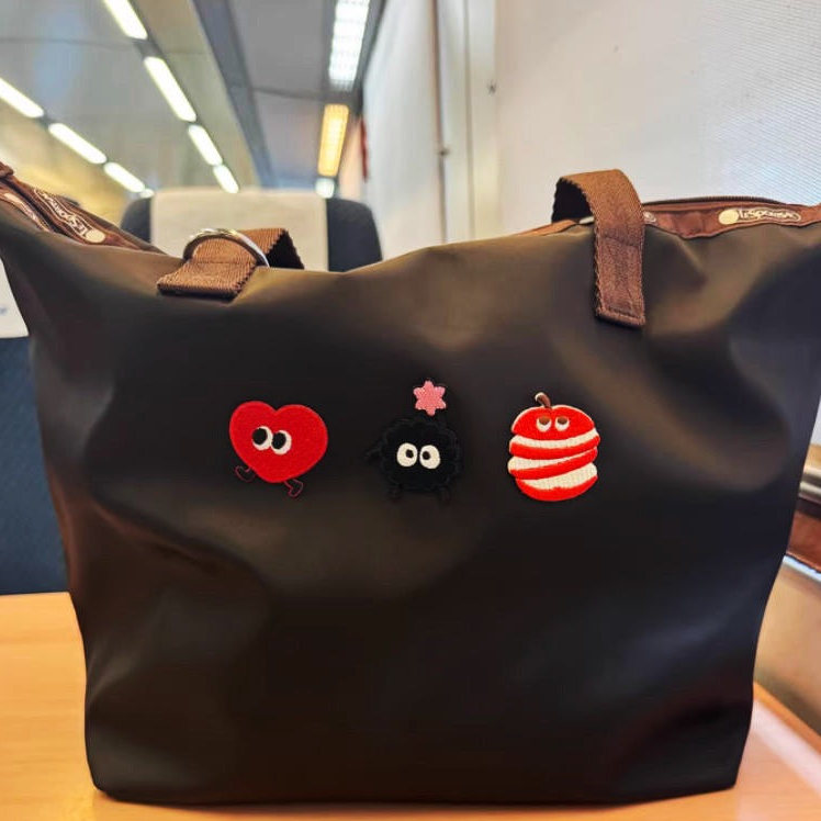 walking fruits embroidered stick-on patches on a bag